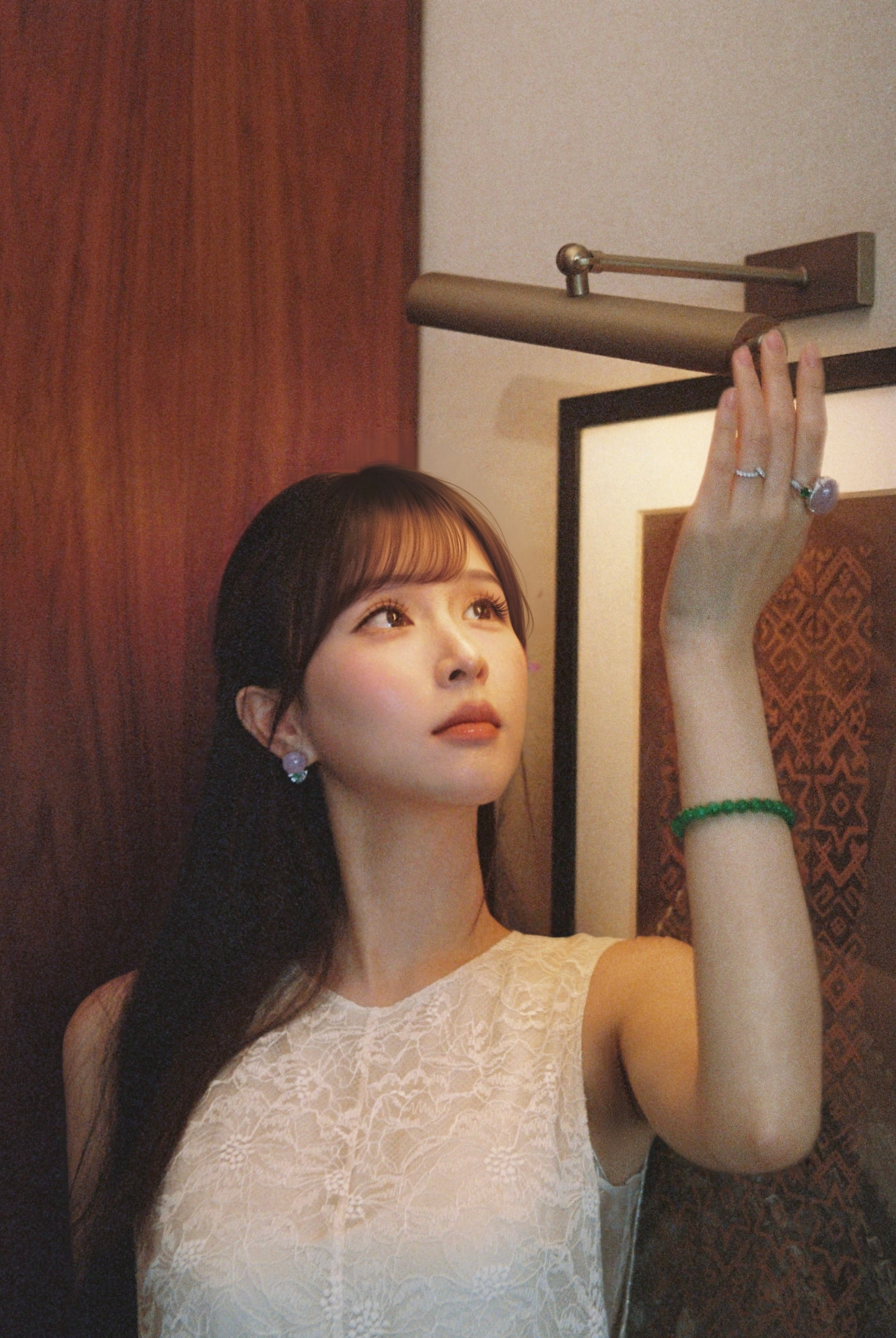 Su, founder of Yuen, wearing jade jewelry